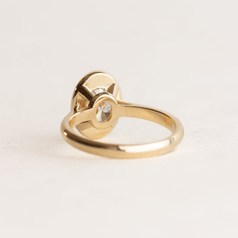 Bezel Set Oval Star Set Side Stones Engagement Ring