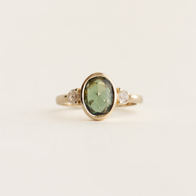 Oval Sapphire Three Stone Bezel Engagement Ring