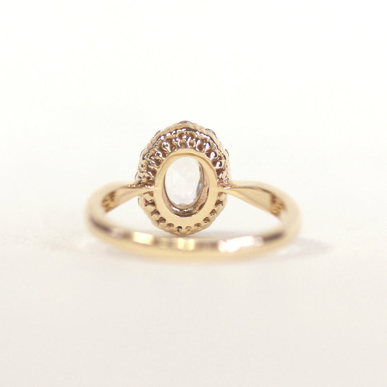 White Oval Stone Halo Engagement Ring