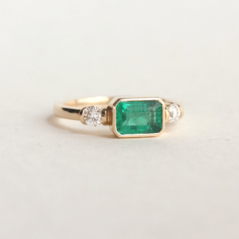Emerald Step Cut East West Engagement Ring