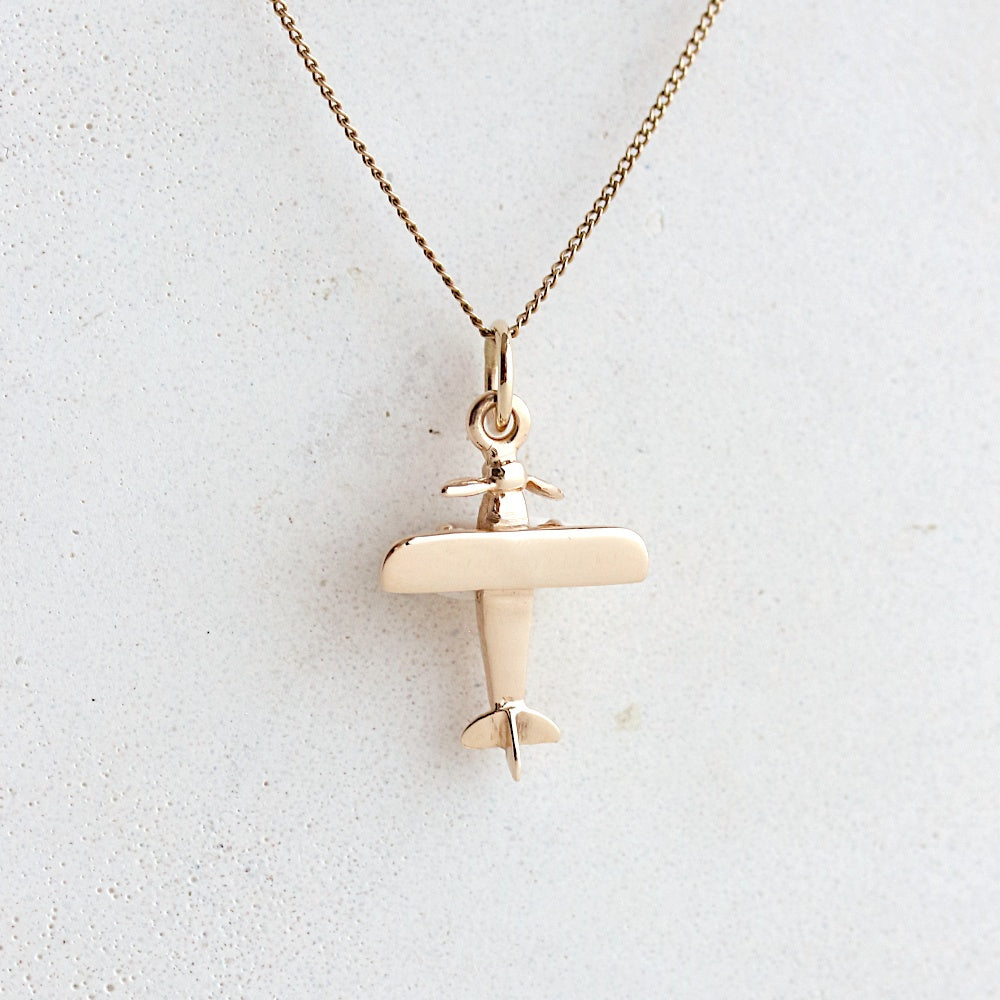 Gold airplane charm hot sale