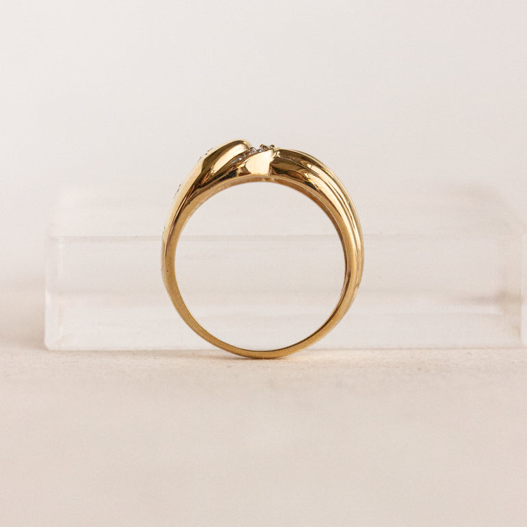 Gold ring on a beige background