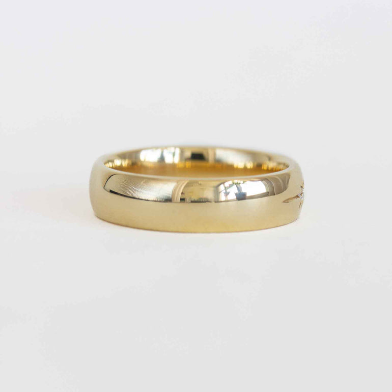 Gold ring on a white background