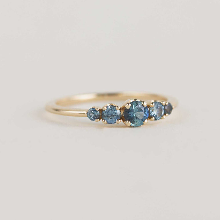 5 stone teal sapphire engagement ring