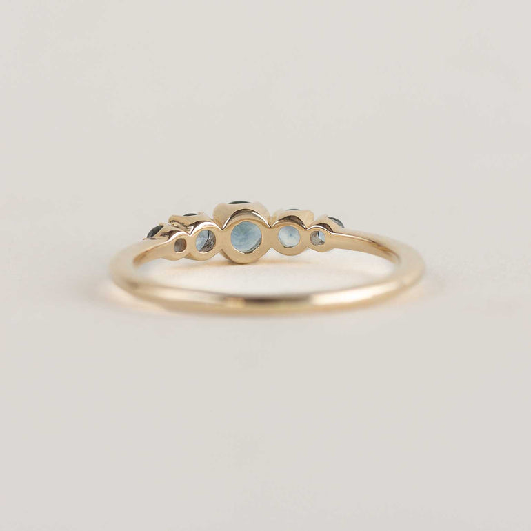 5 stone teal sapphire engagement ring