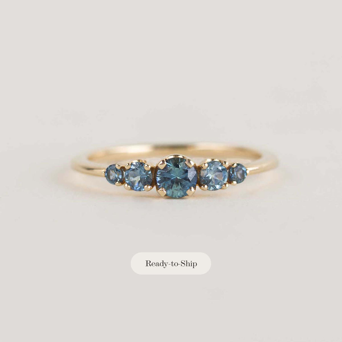 5 stone teal sapphire engagement ring