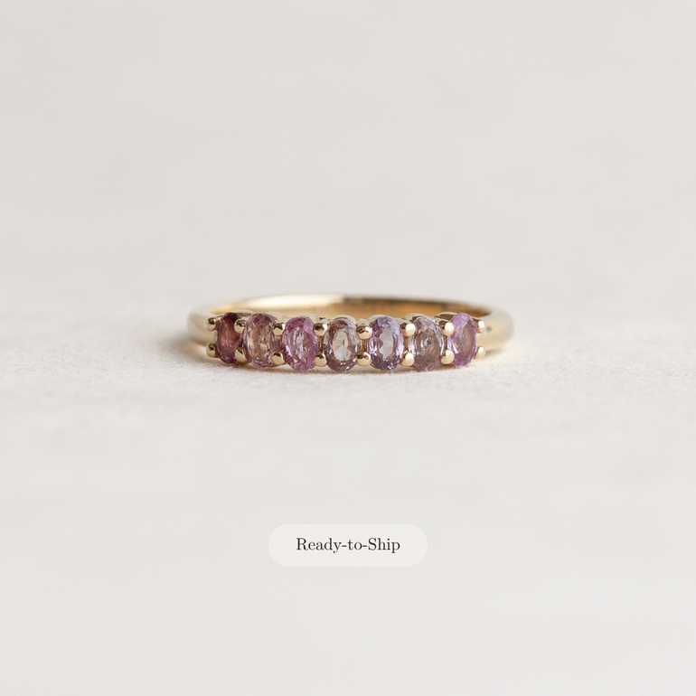 A gold ring with five oval pinkish-purple gemstones, shown on a light gray background with a 'Ready-to-Ship' label below.