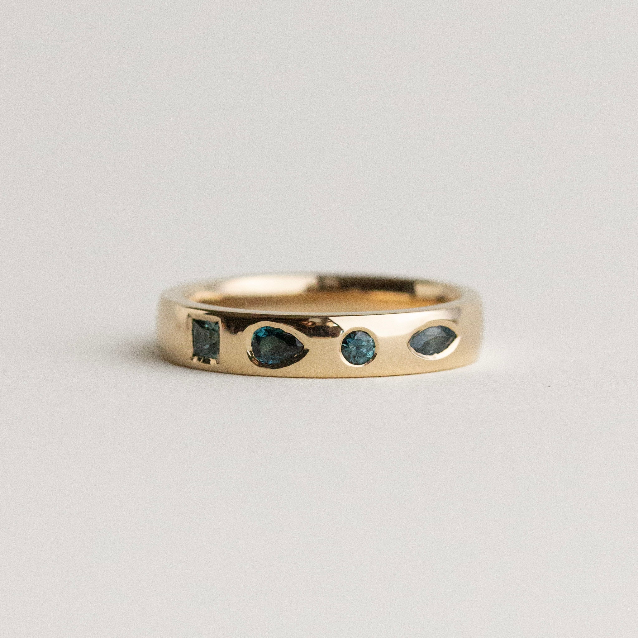 Flush-Set Teal Sapphire Band