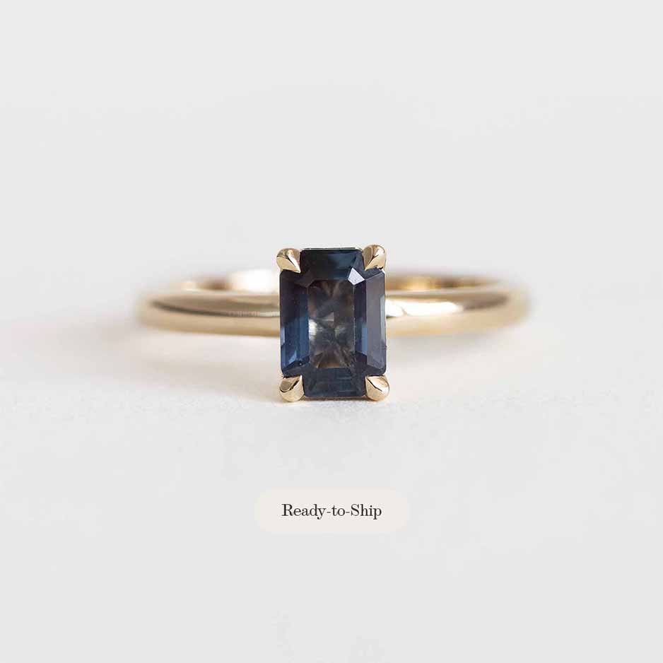 Emerald-Cut Teal Sapphire Ring on a Gold Band