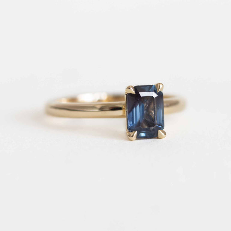 Emerald-Cut Teal Sapphire Ring on a Gold Band