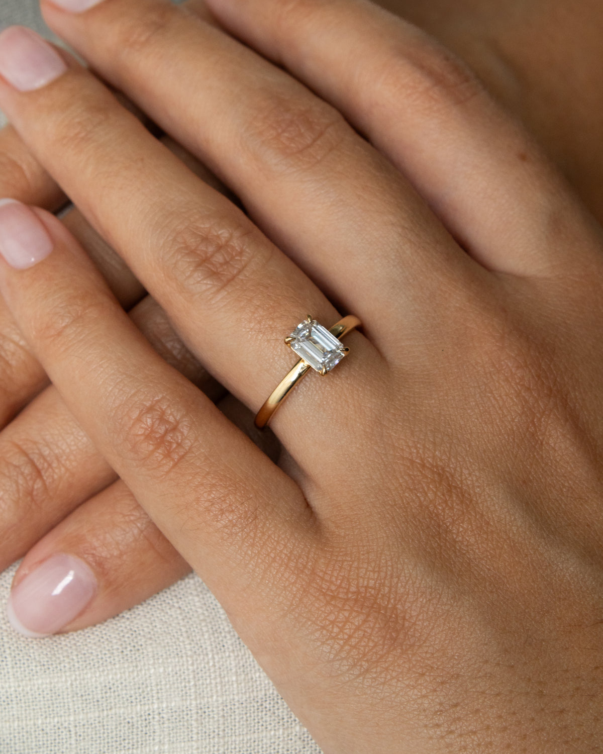 Emerald cut solitaire ring 