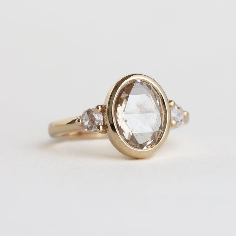 14K gold ring with a bezel-set oval, rose-cut champagne natural diamond