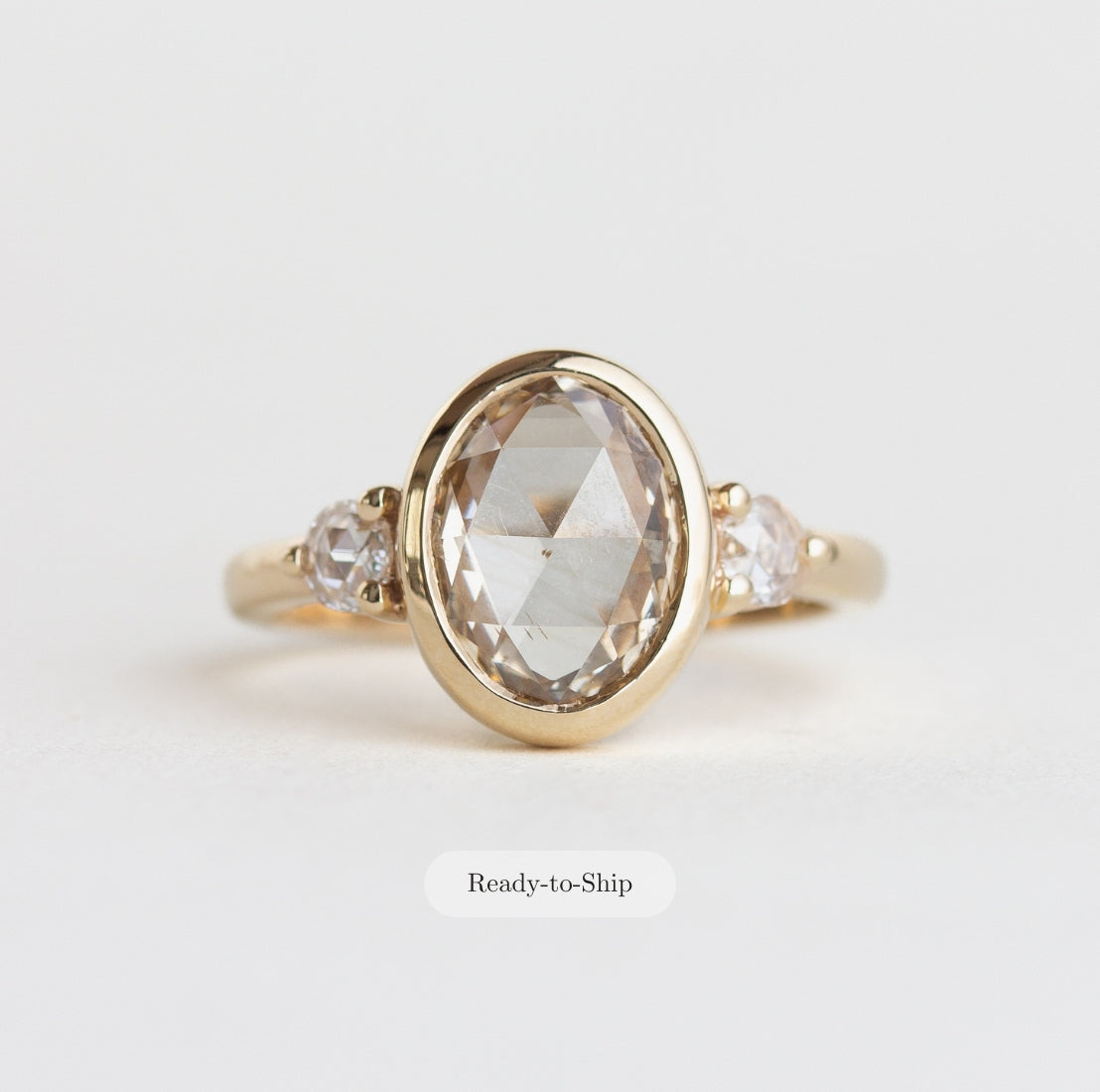 14K gold ring with a bezel-set oval, rose-cut champagne natural diamond