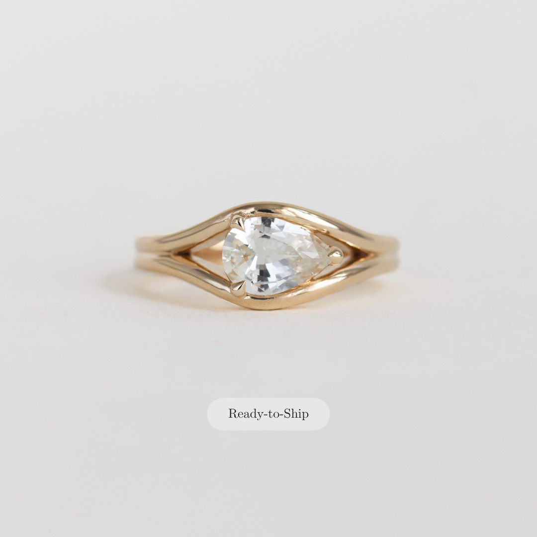 east-west pear engagement ring
