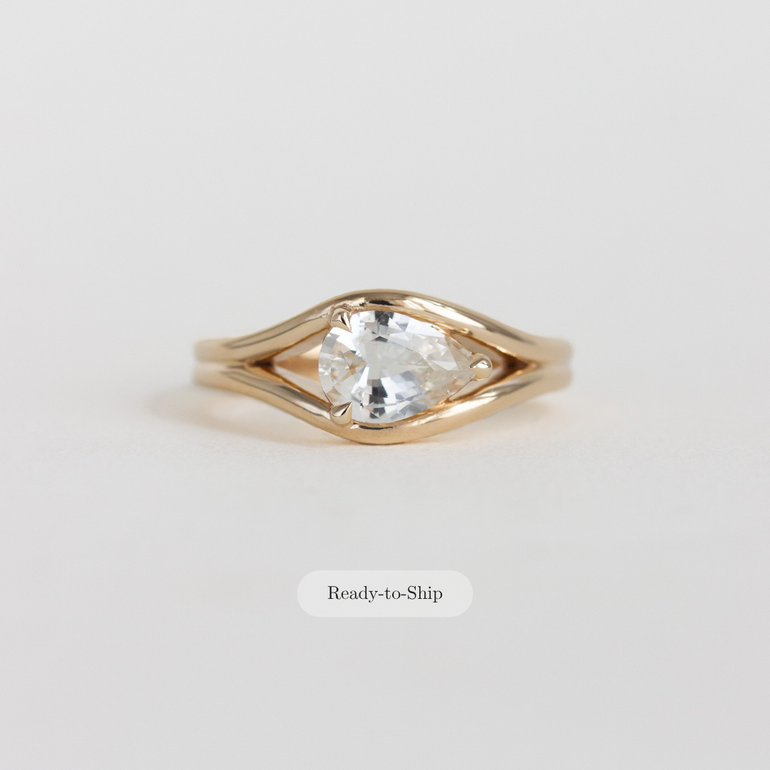 east-west pear engagement ring