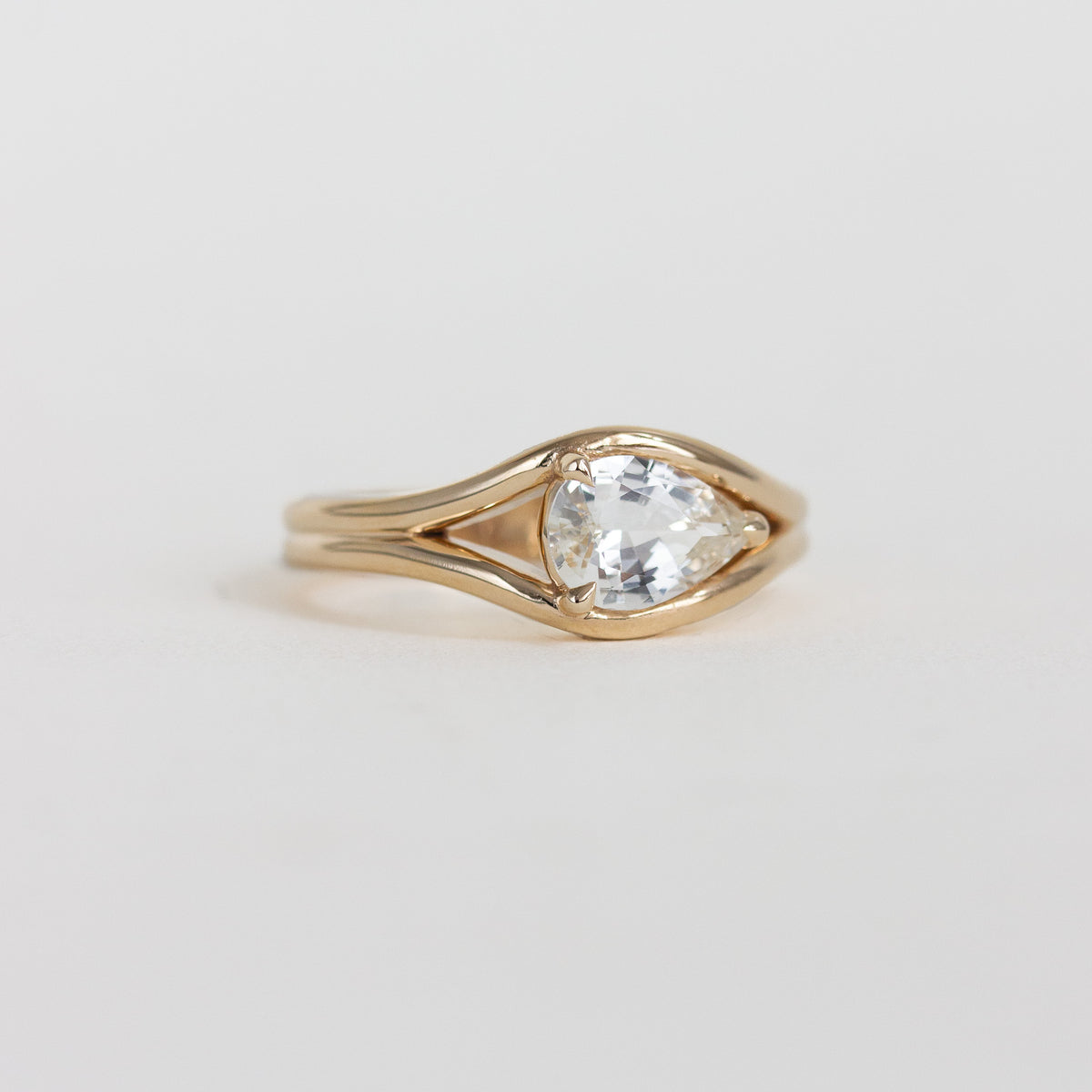 east-west pear engagement ring