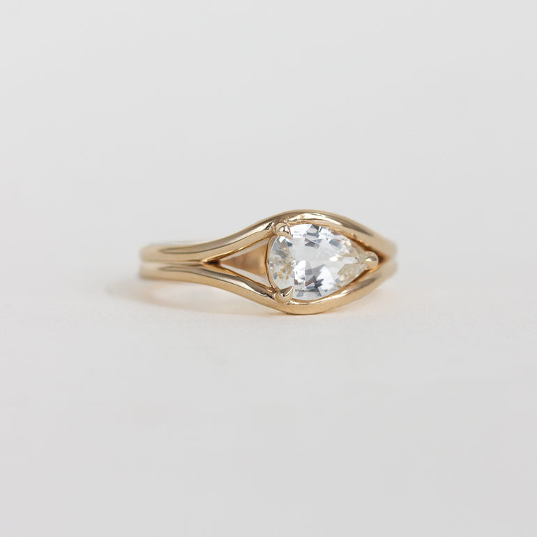 east-west pear engagement ring