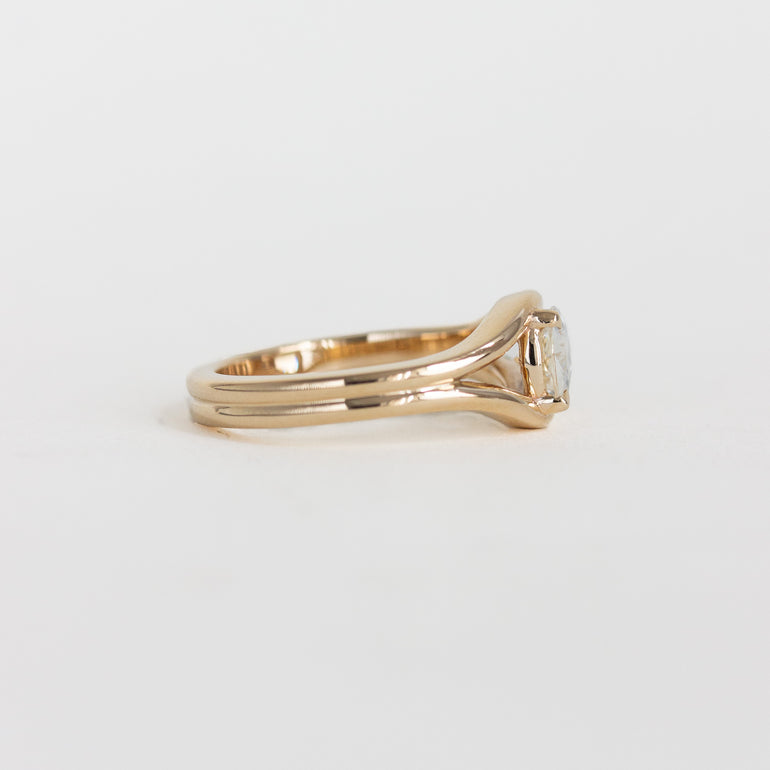 east-west pear engagement ring
