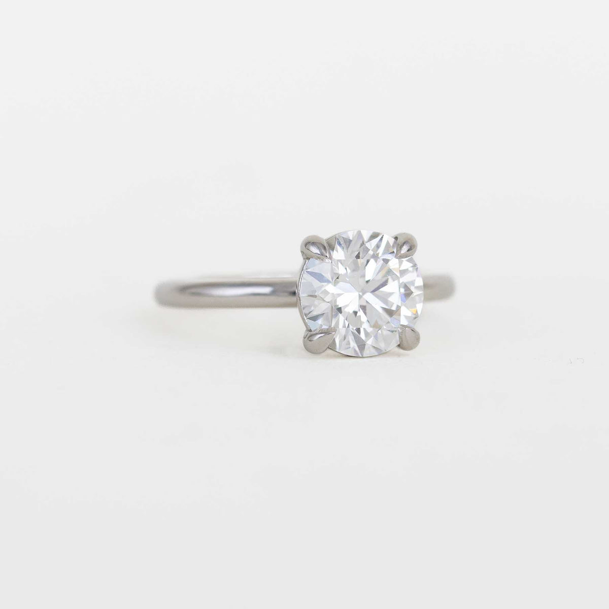 round solitaire diamond ring with a platinum band