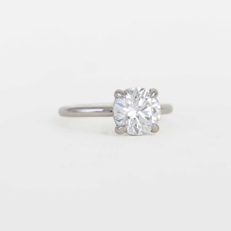 round solitaire diamond ring with a platinum band
