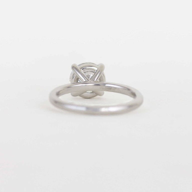 round solitaire diamond ring with a platinum band