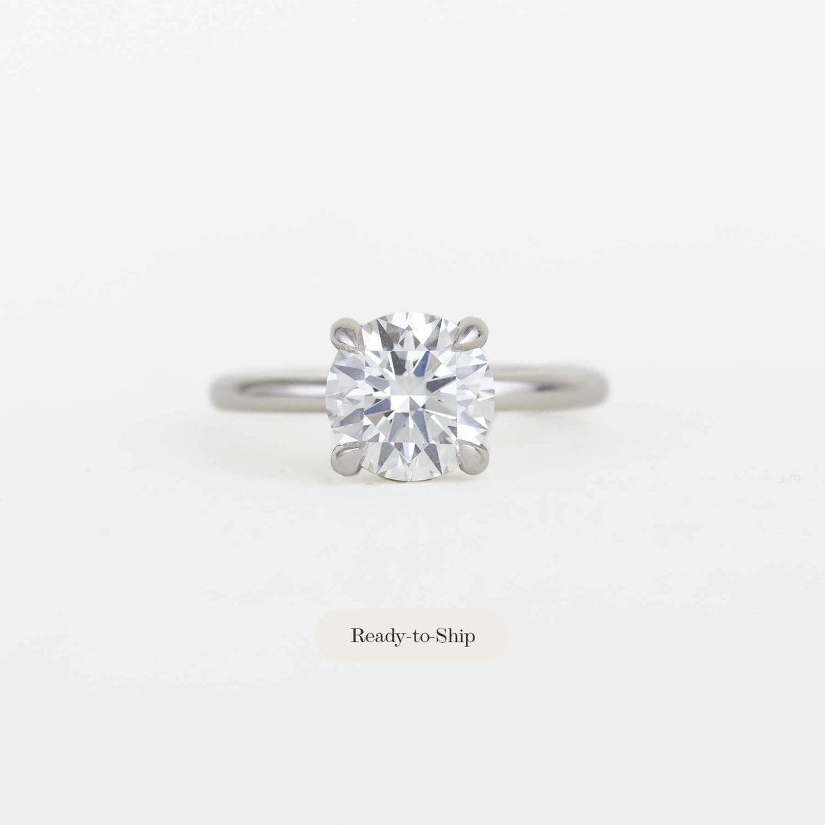 round solitaire diamond ring with a platinum band
