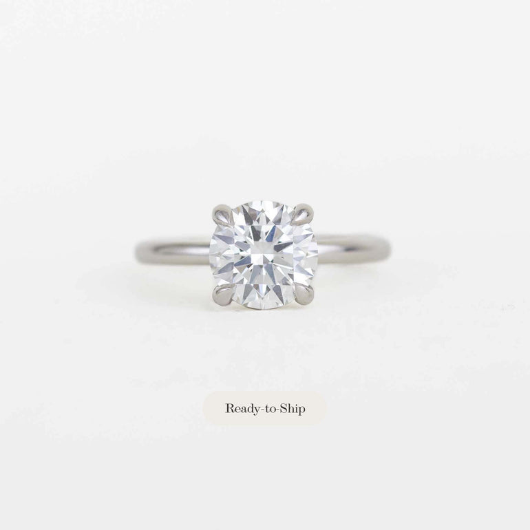 round solitaire diamond ring with a platinum band