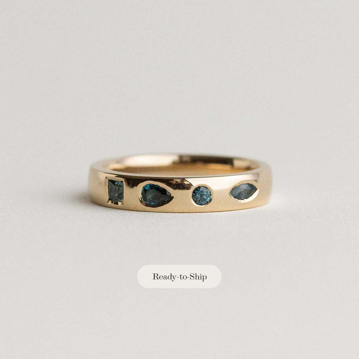 flush set teal sapphire wedding band