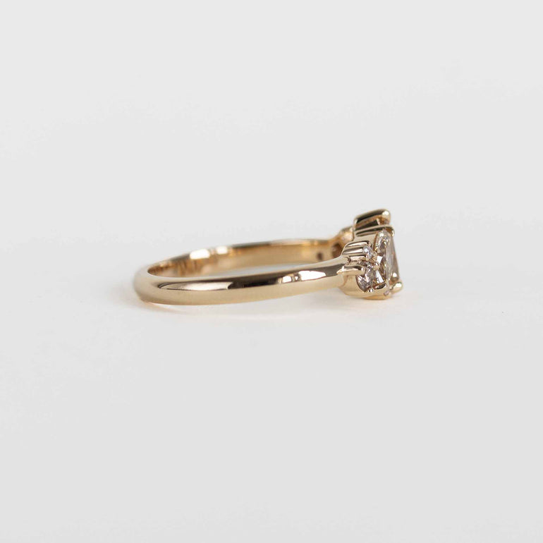 A gold ring cluster ring with champagne and clear natural diamonds, shown on a plain white background.