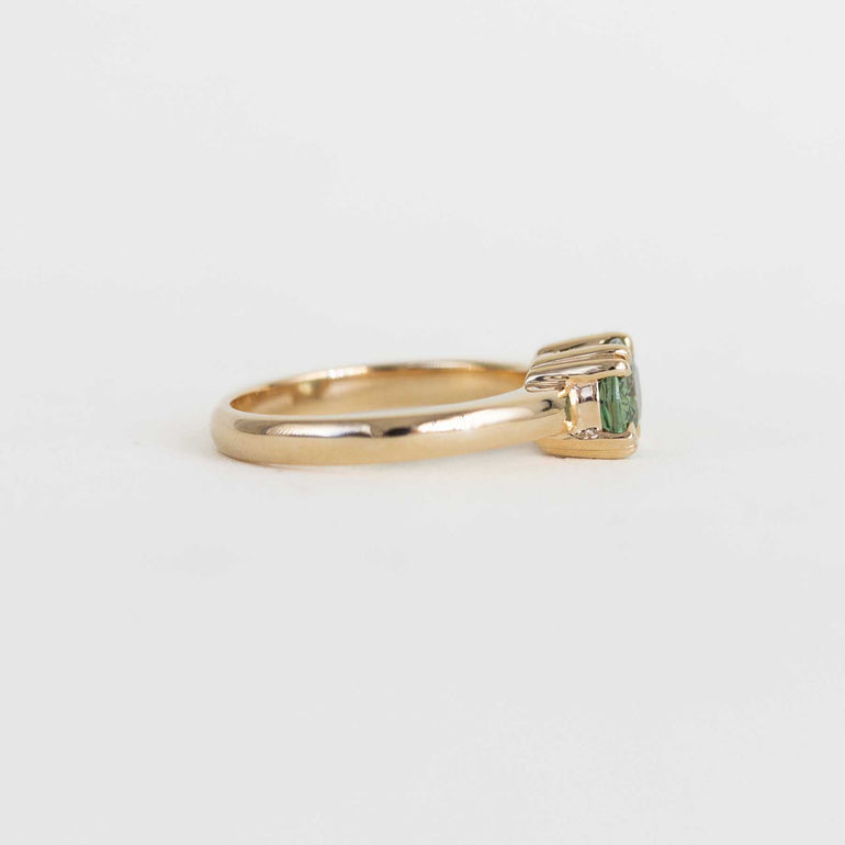 green sapphire east west engagement ring