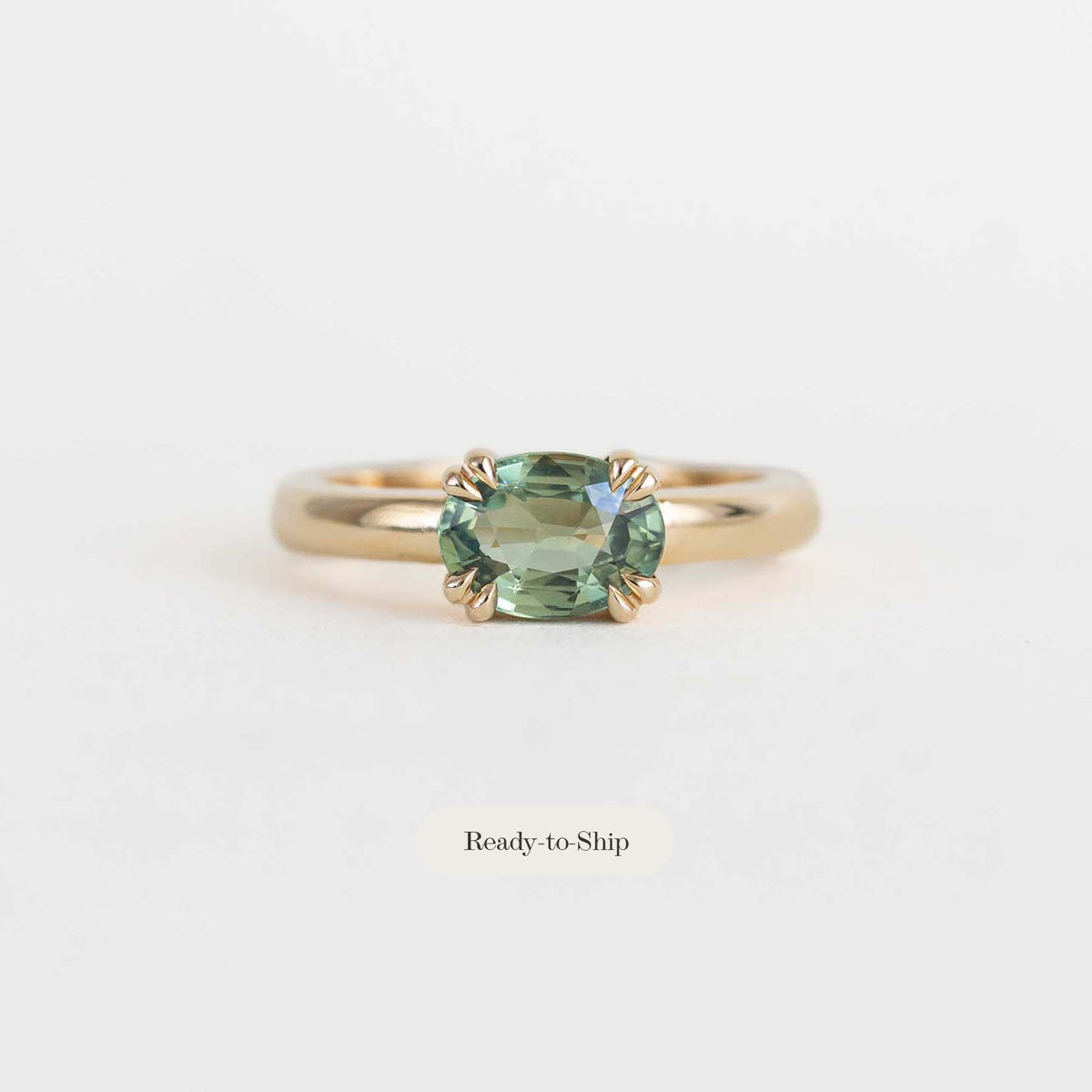 green sapphire east west engagement ring
