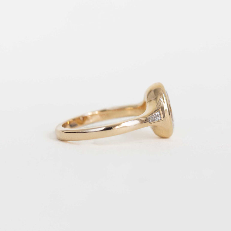 Oval Bezel Set Diamond Ring with Baguette Side Stones