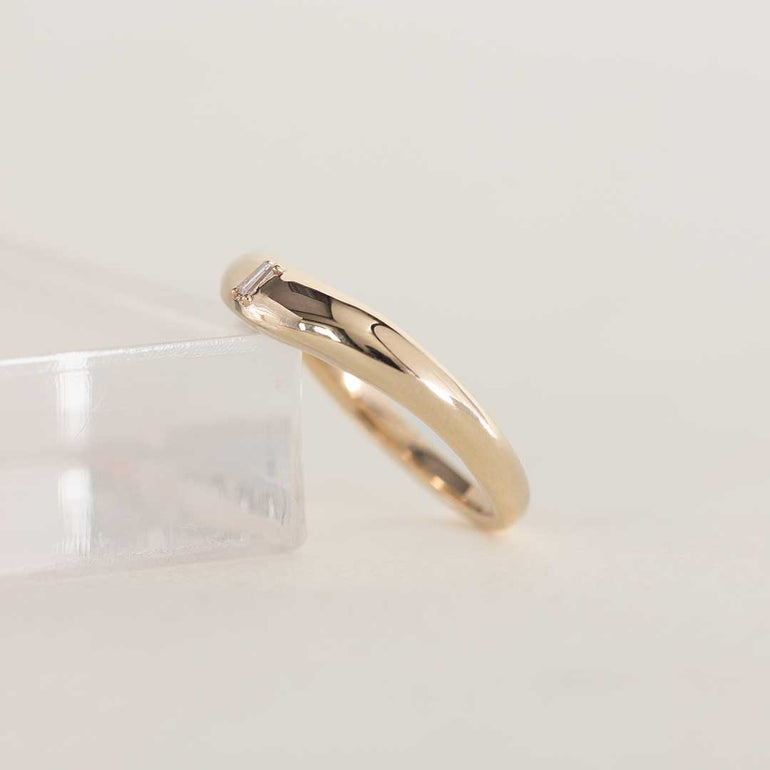 14K chunky gold wedding band with tapered baguette natural diamond