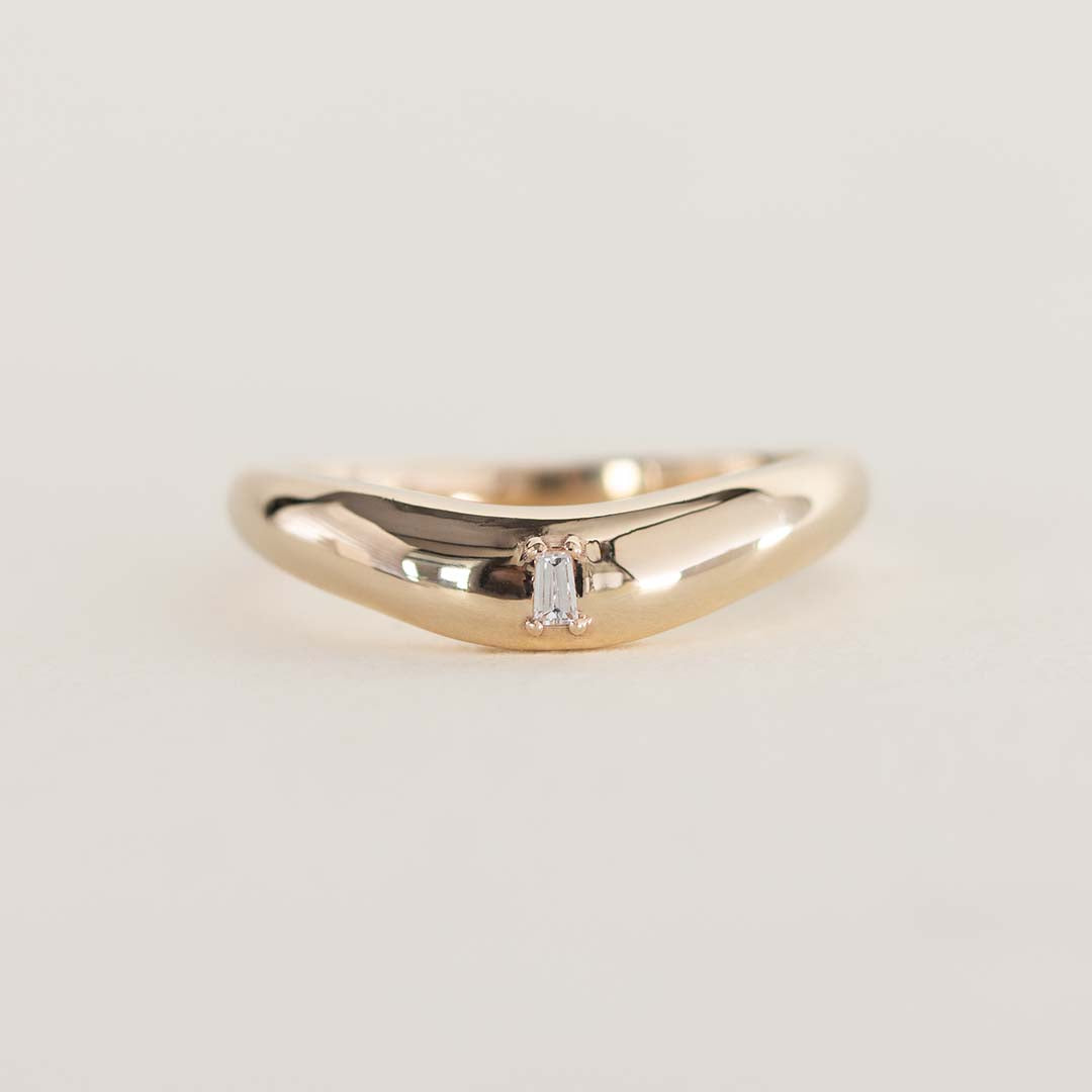 14K chunky gold wedding band with tapered baguette natural diamond
