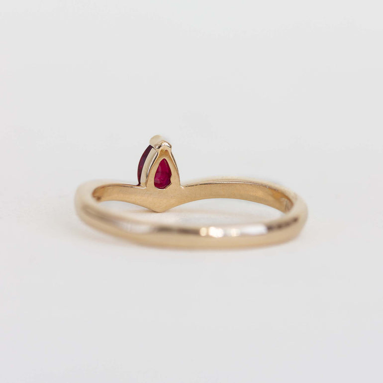 Back side photo of 14K yellow gold ring with pear shaped ruby