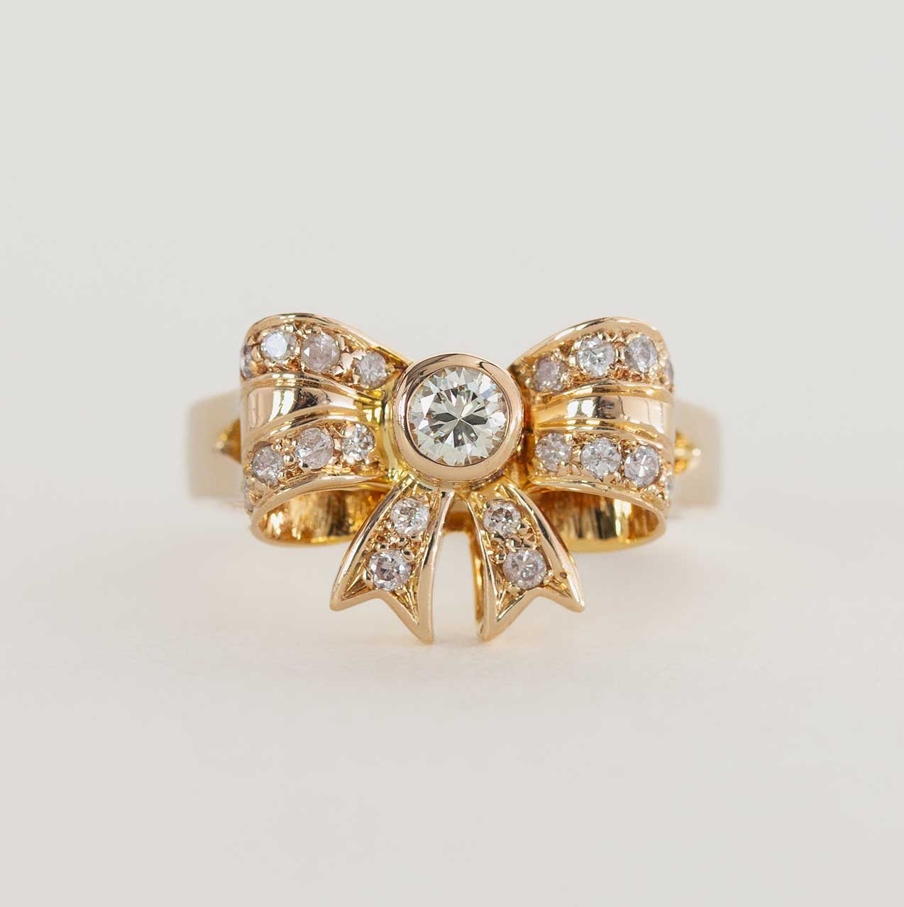 Diamond Bow-Shaped Ring on a Yellow Gold Band