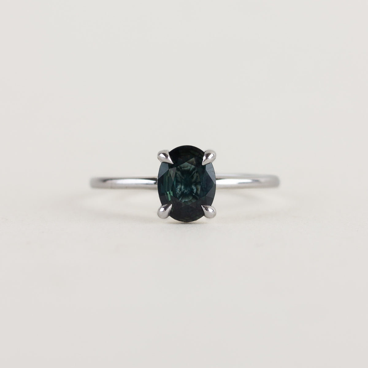 blue sapphire solitaire ring with hidden halo