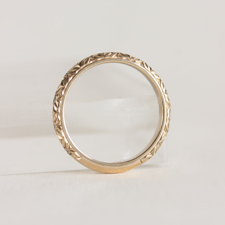 14K gold band, engraved floral design with diamond centres
