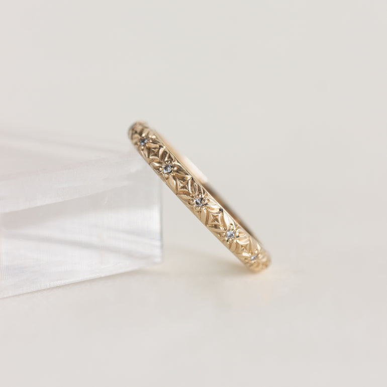 14K gold band, engraved floral design with diamond centres