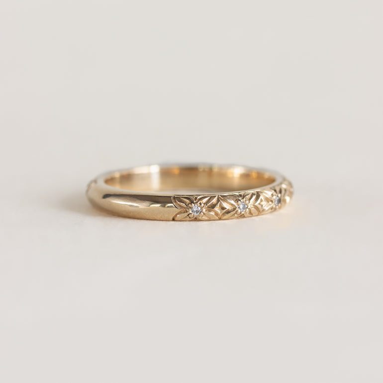 14K gold band, engraved floral design with diamond centres