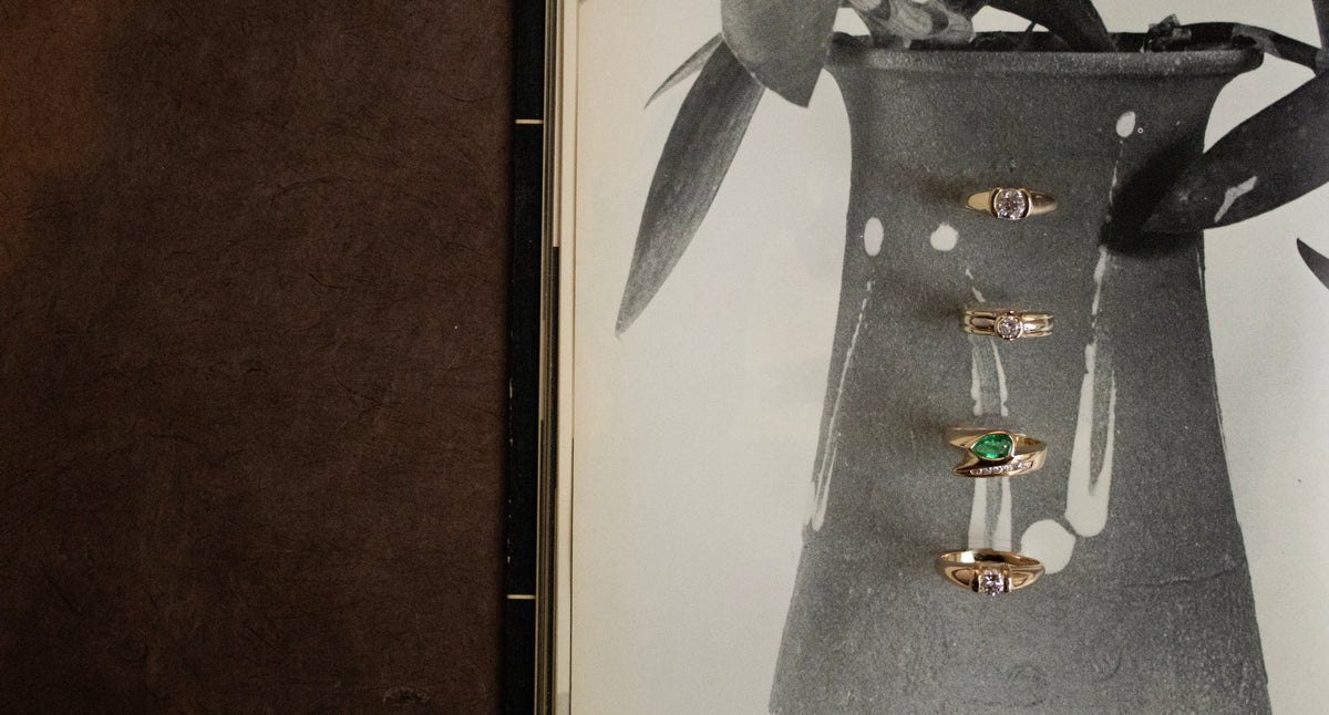 four vintage rings with bezel setting