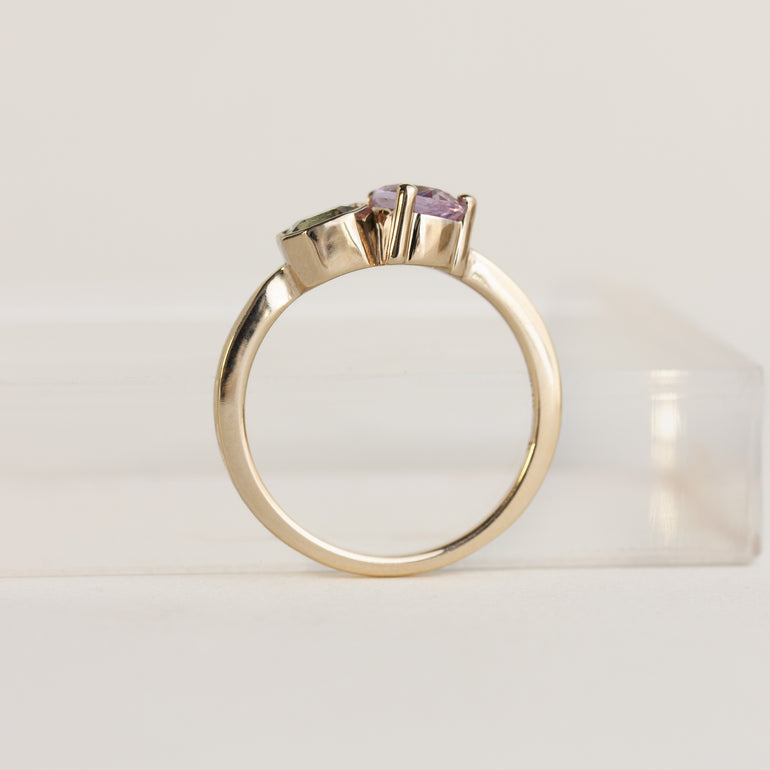 Toi et Moi 14k gold ring with green asscher and lilac pear sapphires