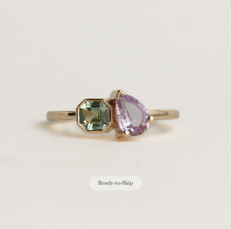 Toi et Moi 14k gold ring with green asscher and lilac pear sapphires