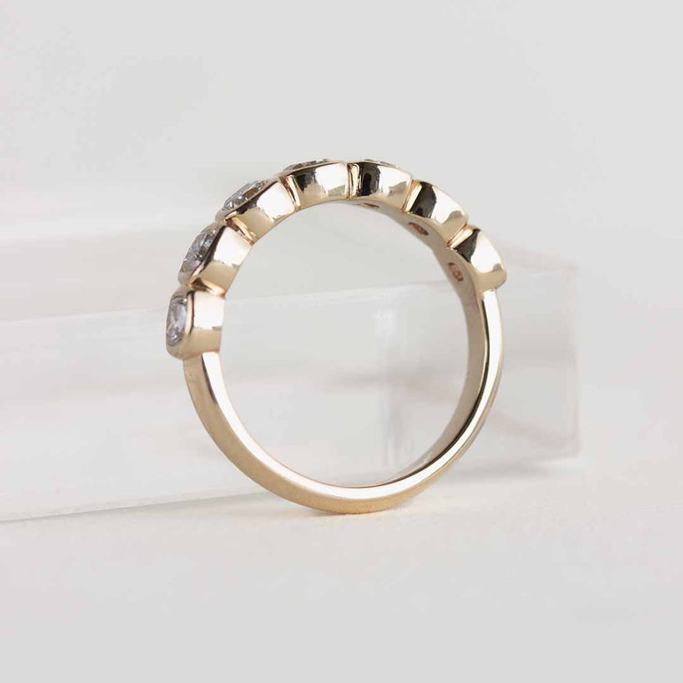 Yellow gold ring with 7 bezel-set, cushion cut laboratory grown diamonds