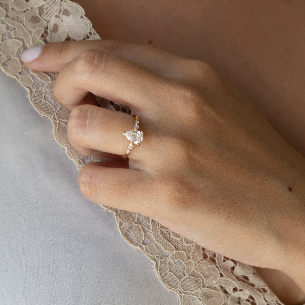 pear diamond ring on hand
