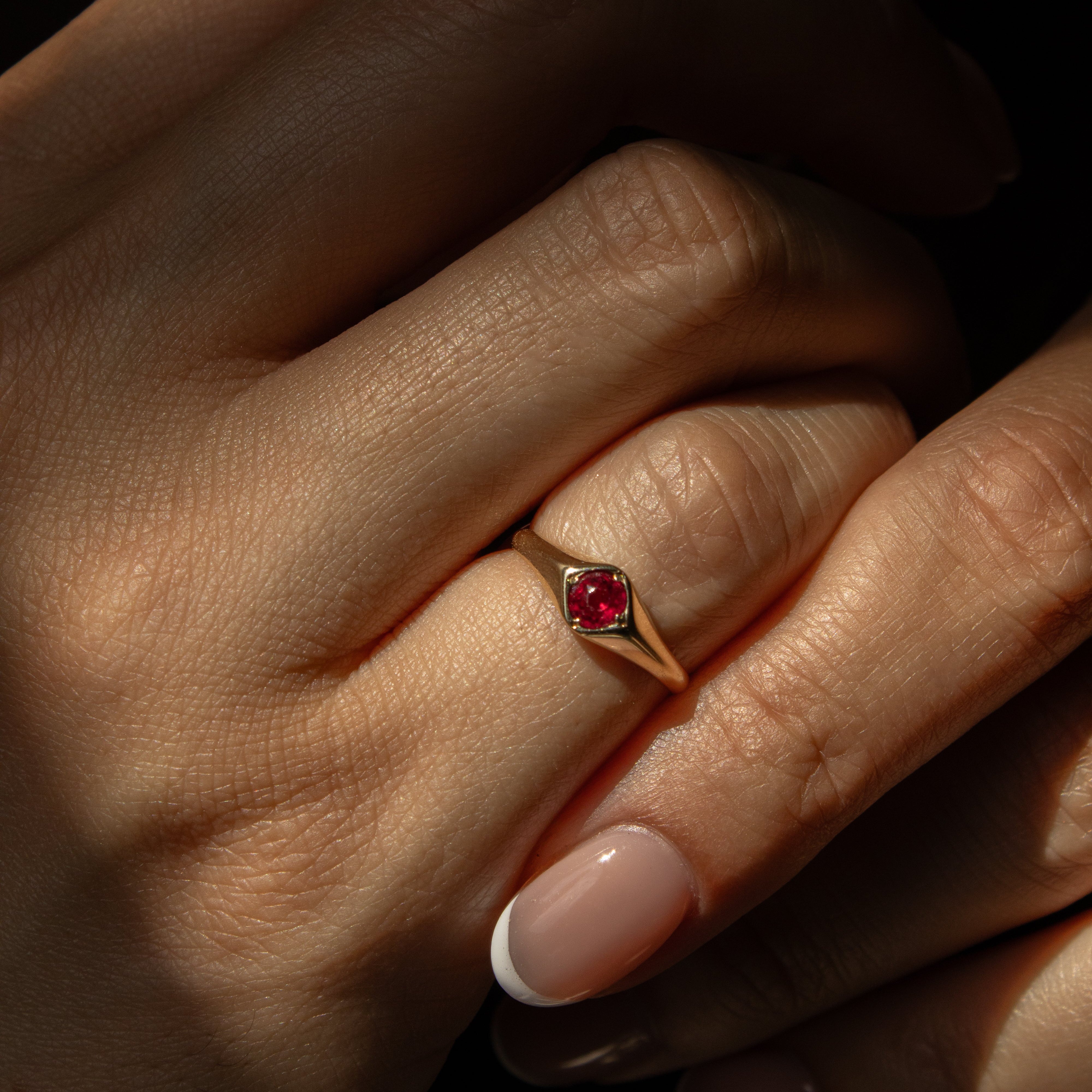 ruby signet ring on a hand