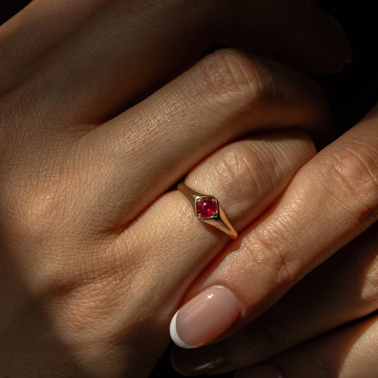 ruby signet ring on a hand