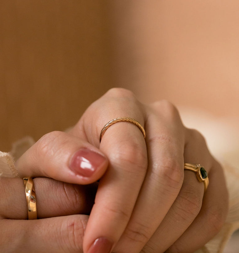 braid twist wedding band on models hand