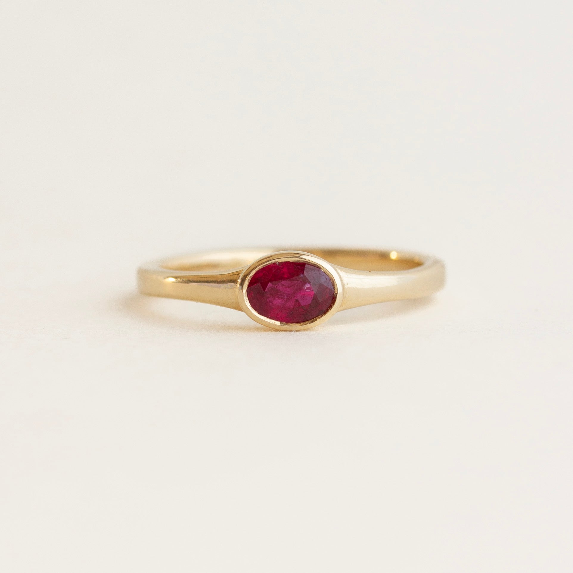 East-West Oval Bezel Ruby Engagement Ring