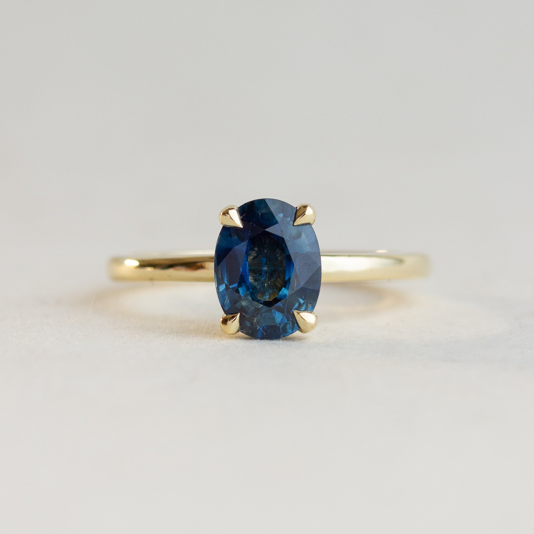 Oval Sapphire Hidden Halo Engagement RIng